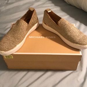 Michael Kors slip ons gold